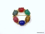 BURT 1/20TH 12K CASSELL ROUND MULTI-COLORED SCARAB BROOCH. MARKED ON THE BACK. IT MEASURES APPROX.