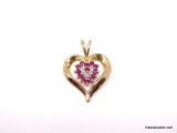 10K YELLOW GOLD HEART PENDANT ACCENTED WITH (13) ROUND CUT PRONG SET RUBY GEMSTONES & SMALL DIAMOND