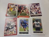 ROW OF ASSORTED FOOTBALL CARDS. PLAYERS INCLUDE:BRIAN BLADOS, BRUCE SMITH, BILL PICKEL, GARY