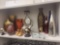 SHELF LOT OF ASSORTED ITEMS TO INCLUDE: TALL DECORATIVE VASES, CANDLE HOLDERS, COPPER BABY SHOES, 2