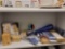 SHELF LOT OF ASSORTED ITEMS. INCLUDES: WOODEN COASTERS, WAX AND WOOD PILLAR CANDLES, SHANNON 24%