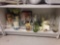 SHELF LOT OF ASSORTED ITEMS TO INCLUDE FAUX LILLIES, WHITE AND RED WINE GLASSES, CANDLEHOLDERS, A