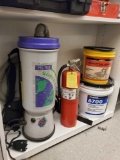 SHELF LOT OF MISC ITEMS, PRO TEAM BACK PACK VACUUM SUPER COACH, FIRE EXTINGUISHER 1994 INSPECTION