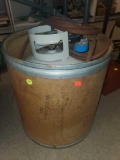 PROPANE FLASK, HAS A HOSE ATTACHED, CONTAINED BY A CARDBOARD BARREL.