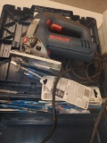 BOSCH 1590 EVS JIGSAW KIT, COMES WITH MULTIPLE BLADES STORED IN THE TOOLS BOX.
