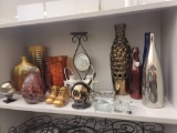 SHELF LOT OF ASSORTED ITEMS TO INCLUDE: TALL DECORATIVE VASES, CANDLE HOLDERS, COPPER BABY SHOES, 2