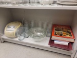 SHELF LOT OF ASSORTED ITEMS TO INCLUDE: A SET OF 3 PYREX NESTING BOWLS, COOK BOOKS, A RED WOOD TRAY,