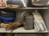 SHELF LOT OF ASSORTED OUTDOOR ITEMS. INCLUDES: A PLASTIC WATERING CAN, ANTIQUE YOKE, 5 SMALL PLASTIC