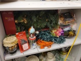 SHELF LOT TO INCLUDE BRAND NEW 9 FT. GOLD TRIM GARLAND, ORANGE EXTENSION CORD, CHRISTMAS STRING