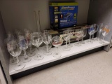 SHELF LOT TO INCLUDE LARGE LOT OF MISC. STEM GLASSES FROM VARIOUS PLACES, SPEEDBOOSTER WIRELESS