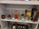 SHELF LOT TO INCLUDE 3 GLASS OIL LAMPS, 7 GLASS OIL LAMP GLOBES, PAIR OF SILVERPLATE CANDLE STICK