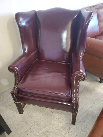RED LEATHER WINGBACK ARMCHAIR, BRASS TACK ACCENTS, IS IN GOOD USED CONDITION, SOME NORMAL WEAR AND