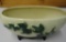 WHITE PLANTER WITH GREEN LEAVES ALL ITEMS ARE SOLD AS IS, WHERE IS, WITH NO GUARANTEE OR WARRANTY.