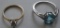 2 STERLING RINGS ? 1 CLEAR STONE, 1 BLUE STONE ALL ITEMS ARE SOLD AS IS, WHERE IS, WITH NO GUARANTEE