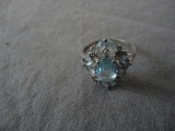 STERLING RING WITH LIGHT BLUE STONES ALL ITEMS ARE SOLD AS IS, WHERE IS, WITH NO GUARANTEE OR