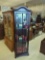 CONTEMPORARY DARK STAINED WOOD & GLASS CURIO CABINET WITH TWO GLASS SHELVES. BRASS PULL ON THE DOOR,