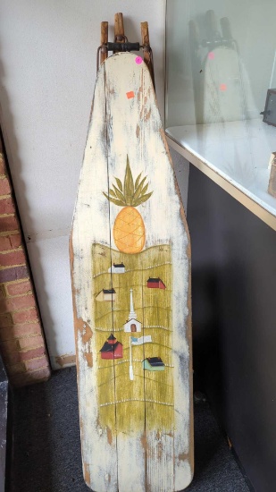 EARLY STYLE WOODEN IRONING BOARD DECORATION, ITEM HAS A PINEAPPLE AND HILLSIDE SCENE PAINTED ON THE