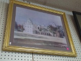 FRAMED PRINT OF A MIDDLE EASTERN STYLE BUILDING. DISPLAYED IN A GOLD TONE FRAME WITH BROWN MATTING.