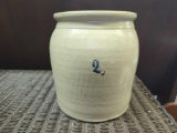 VINTAGE MARKED #2 TAN GLAZED CROCK WITH LINE DETAILING A LONG THE TOP. MARKED IN BLUE. BROWN SLIP