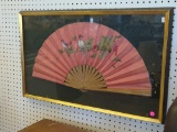 VINTAGE FRAMED HAND HELD FOLDING FAN WITH BIRD & GRAPE VINE DETAILING. DISPLAYED IN A BLACK AND GOLD