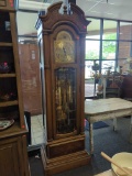 HOWARD MILLER CLOCK COMPANY GRANDFATHER CLOCK. BEAUTIFUL MOVING SCENE AT THE TOP. HAS ALL WEIGHTS