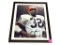FRAMED & AUTOGRAPHED PHOTO OF JIM BROWN. DISPLAYED IN A BROWN FRAME. IT MEASURES APPROX. 9-1/2