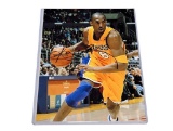 UNFRAMED & AUTOGRAPHED PHOTO OF KOBE BRYANT. COMES WITH A PLASTIC PROTECTIVE SLEEVE. IT MEASURES
