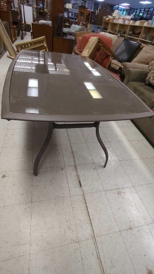 METAL AND GLASS TOP PATIO TABLE MEASURES APPROXIMATELY 65 IN X 40 IN X 29 IN, GLASS NEEDS CLEANING