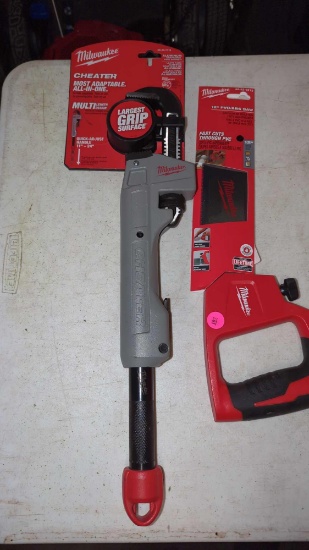 LOT OF 2 ITEMS TO INCLUDE, MILWAUKEE 12-IN PVC- ABS SAW NEW IN THE PACKAGE, AND A MILWAUKEE CHEATER