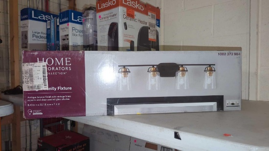 HOME DECORATORS COLLECTION GODDARD 4 LIGHT VANITY FIXTURE, IN THE ORIGINAL BOX SEALED.