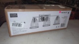 HOME DECORATORS COLLECTION VANITY LIGHT, SILVER METAL AND GLEAR GLASS, IN THE ORIGINAL BOX, RESEALED
