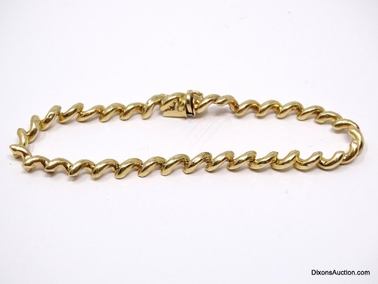 UNIQUE 14K YELLOW GOLD TWISTED LINK BRACELET. MARKED "14K F". IT MEASURES APPROX. 7" LONG & WEIGHS