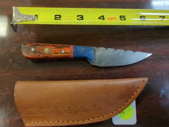 HANDMADE DAMASCUS STRAIGHT BACK KNIFE WITH ORANGE AND BLUE COLORED HANDLE. BLADE MEASURES 3". COMES