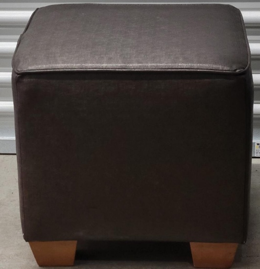 BROWN FOOT STOOL W/WOOD FEET. MEASURES APPROX. 18.5" X 18.5" X 18.5". ITEM IS SOLD AS IS WHERE IS