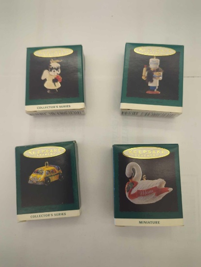LOT OF 4 HALLMARK KEEPSAKE ORNAMENTS TO INCLUDE, NUTCRACKER GUILD, NATURE'S ANGELS, ON THE ROAD, AND