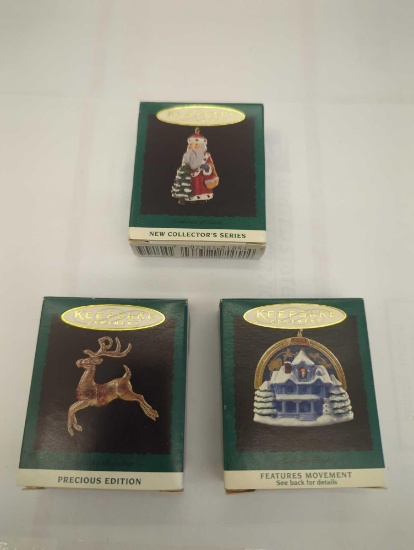 LOT OF 3 HALLMARK KEEPSAKE ORNAMENTS TO INCLUDE, DAZZLING REINDEER, CENTURIES OF SANTA, AND A MERRY