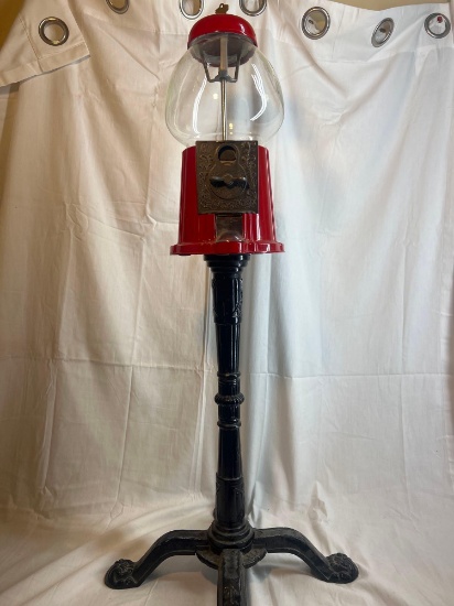 Vintage Gum ball machine with key. Measures approx 37".