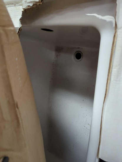 Delta 60"x32" white bathtub. Comes in damaged opened box as is shown in photos. Appears to be used.