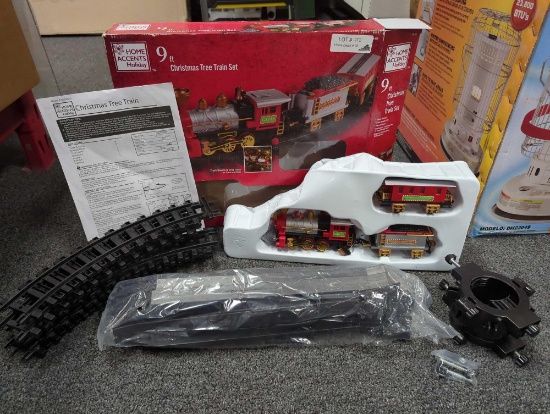 Home Accents Holiday 9 ft Christmas tree train set. Comes in open box as it's shown in photos.