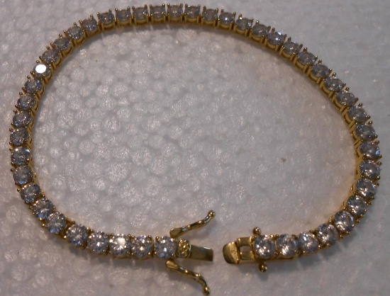 925 TENNIS BRACELET WITH CLEAR STONES ALL ITEMS ARE SOLD AS IS, WHERE IS, WITH NO GUARANTEE OR