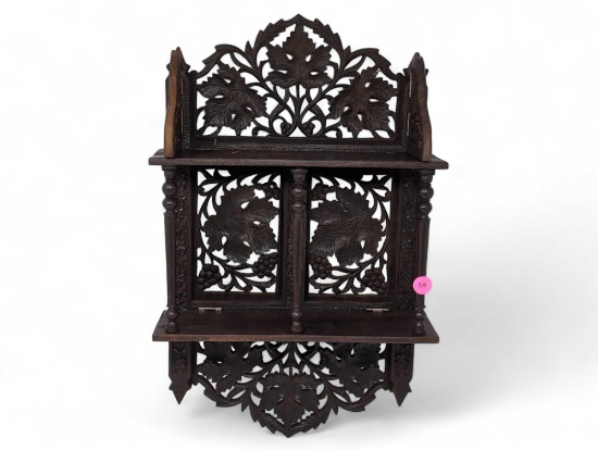 (LR) ANTIQUE ORNATE CARVED WOOD INDIAN FOLDING WALL SHELF WITH LEAF AND FLORAL DETAILING. IT