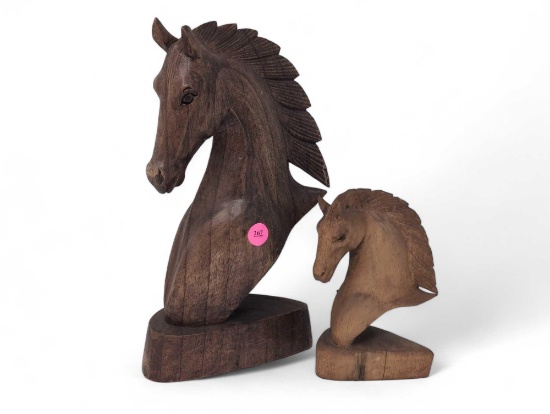 (LR) LOT OF (2) CARVED WOODEN HORSE STATUES. THE LARGEST IS A DARKER WOOD AND MEASURES 6"W X 3"D X
