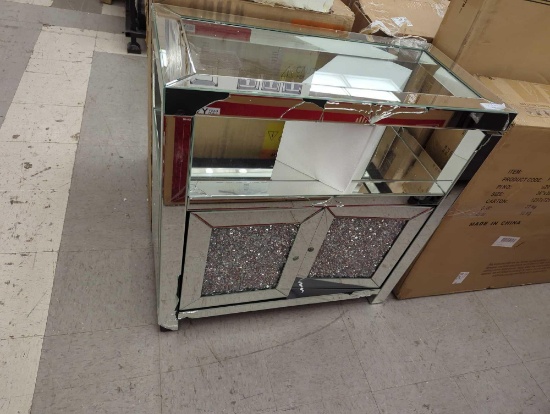 DAMAGED UNIT, CRACKED MIRRORED SIDE TABLE, 2 LOWER DOORS, 1 UPPER DISPLAY CUBBY, MEASURES