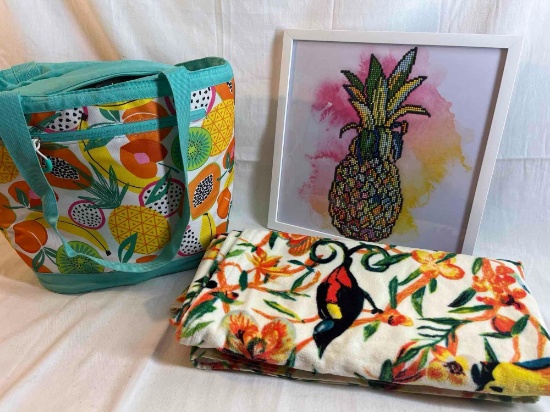 Cooler bag, decorative picture and beach towel.