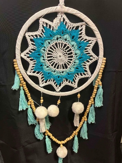 Crochet dream catcher. Turquoise, cream with wooden beads and pom pom accents. Hoop is 10", entire