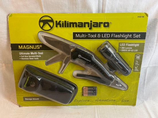 Kilimanjaro multi-tool and LED flashlight set with carrying case and batteries. New in packaging....
