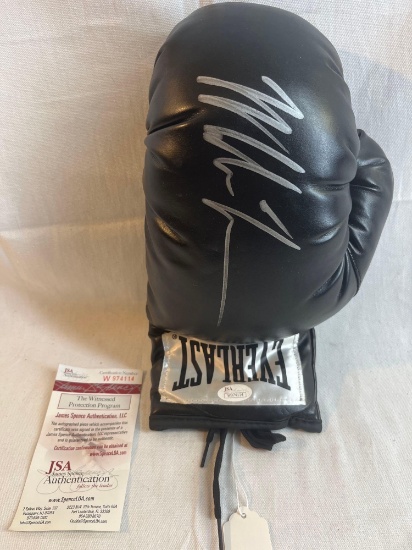 Black Everlast Boxing Glove Autographed by Mike Tyson with certificate of authenticity. Signed in