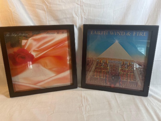 Two framed album covers - Earth Wind & Fire and the autographed Isley Brothers