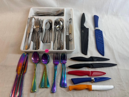 Flatware lot including plastic knives and colorful silverware