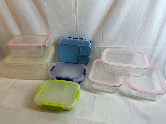 Lot of food storage containers. Some glass, some plastic. All with lids....